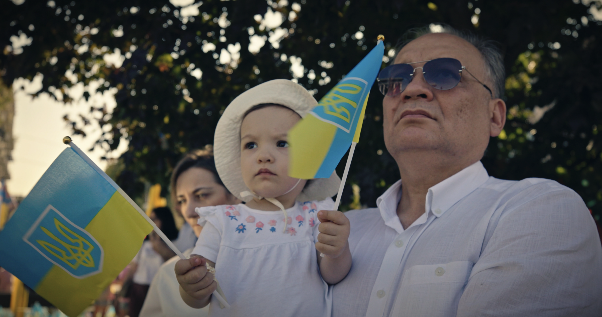 Eskender Bariiev holds his daughter Safiie on Ukrainian Independence Day.