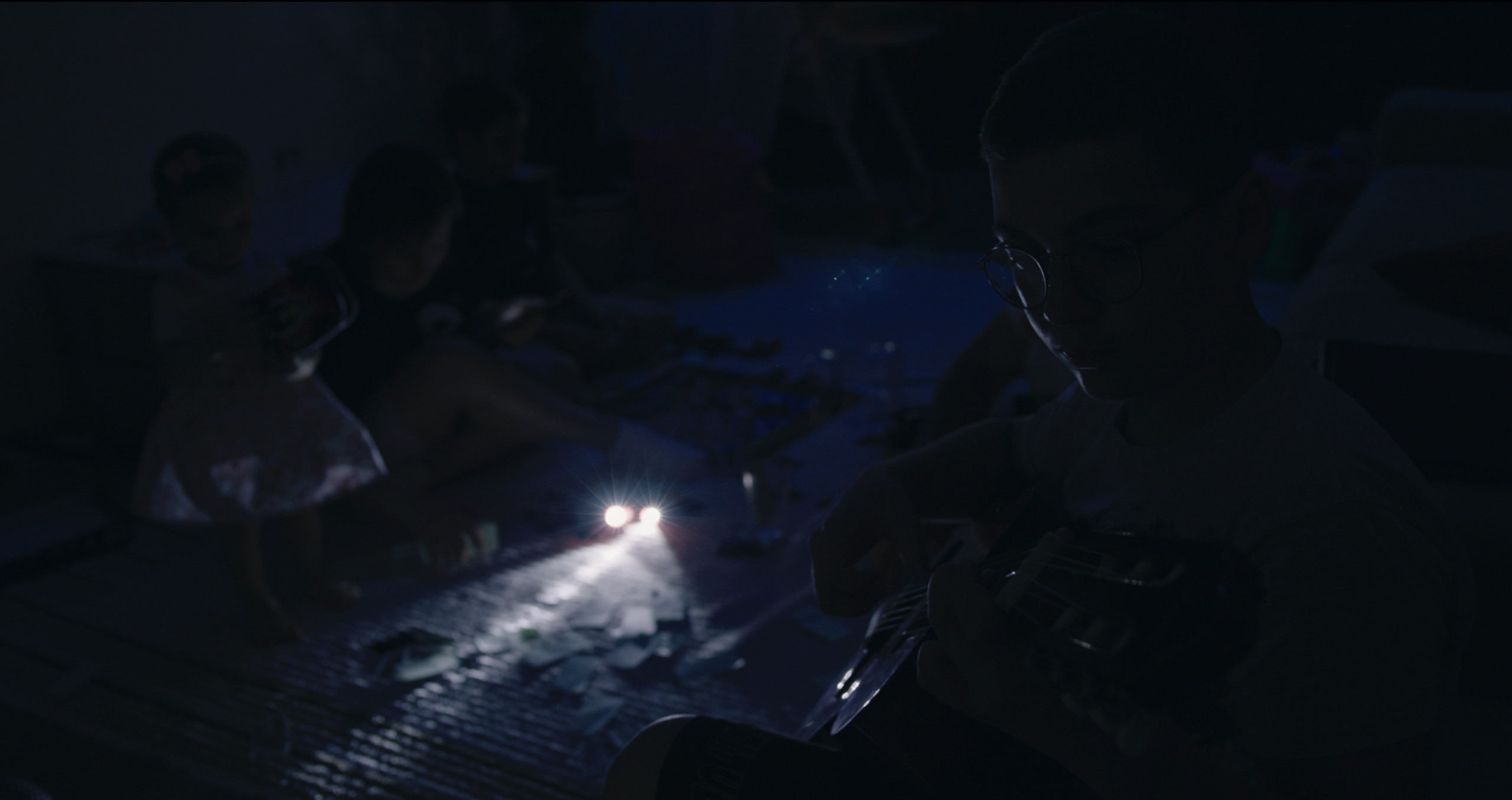 The Bariievs and their children spend time together during a blackout, one of many caused by Russia’s strikes on Ukraine’s energy system.